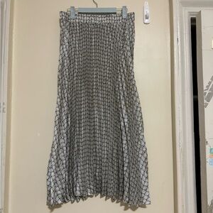 Long pleated, designed navy and lighter blue lines, tight waist band, worn once.